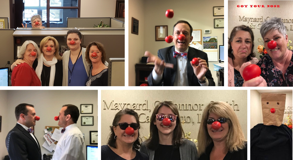 Members of the firm wearing red noses for Red Nose Day